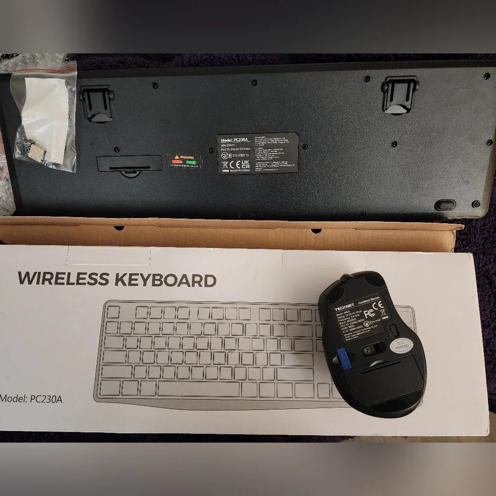 Wireless Keyboard Is Black andTECK NET Mouse Is Black and Purple U Get Both